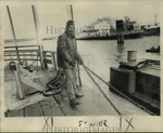 1976 Press Photo Alvin Boseman Clamps Chains At Car Entrance On The Ferry.. Fixed Price $24.99.