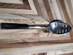 Ekco Chromium Plated Keyhole Slotted Spoon Black Plastic Handle 11-7/8". Fixed Price $11.00.