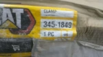 New Oem Caterpillar 3451849 Clamp 345-1849. Fixed Price $50.00.