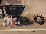 Bosch JS260 Jigsaw Set W/ Blades, Milescraft Sawguide, Clamp & Tool Bag. Fixed Price $70.00.