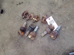 John Deere 2010 Tractor, 5 Wheel Clamps 4 Stops, Tag #670. Fixed Price $100.00.