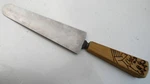 Stainless Steel Cheese Knife With Wooden Handle Cow Drawing Branded On 11". Fixed Price $12.99.